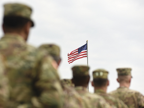 Soldiers and flag